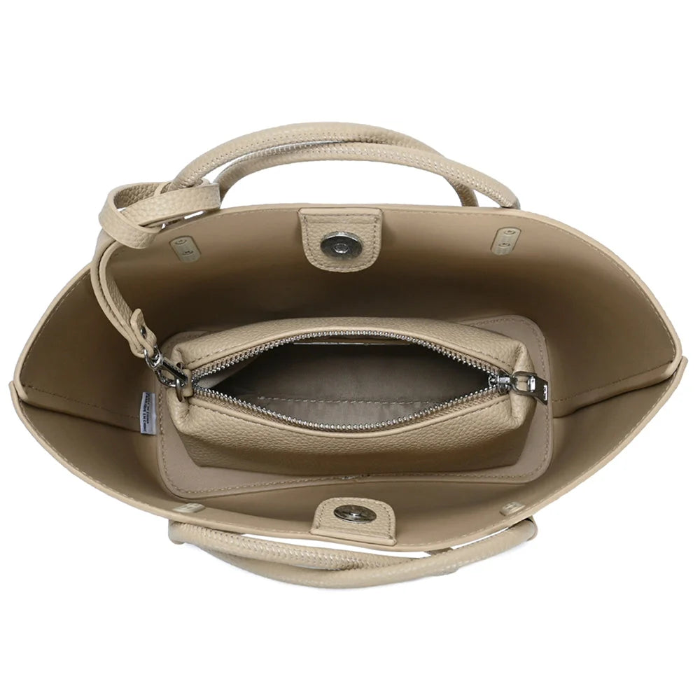 Beige tote bag with smooth textured finish and integrated zipper pouch for versatile use