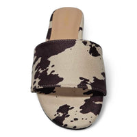 Best Wide Band Cow Faux Slides featuring stylish cow-print slide sandal design