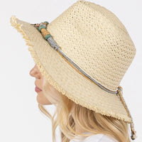 Straw sun hat with braided starfish band for a stylish beach look