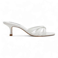 White heeled sandal from Cary Strappy Mule Sandals collection, elegant flared design