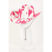 Pink and white cowboy hat on a martini glass for Cow Print Draw String Cowboy Hat