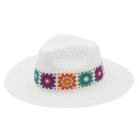 White straw hat with a colorful floral crochet band perfect for summer styling