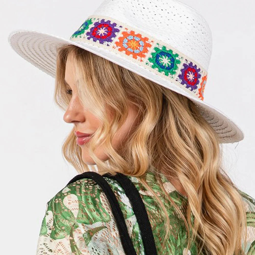 White straw hat with colorful floral crochet band for stylish sun protection