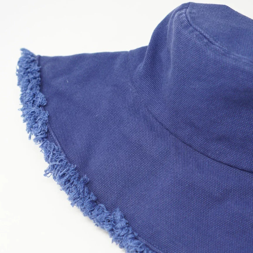 Blue fringed sun hat featured in the Keanu Twill Raw Edge Bucket Hat product