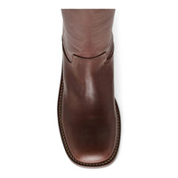 Brown leather boot featuring a leather block heel and 4 inch shaft from Riggs Banana