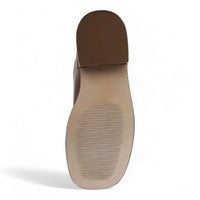 Brown shoe sole with horizontal treads of Riggs Banana Leather Block Heel Boot