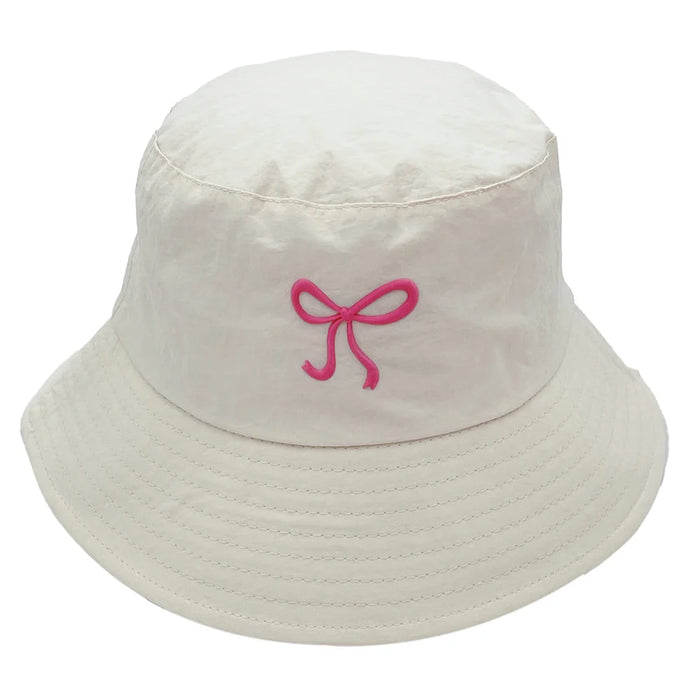 White rubber bow bucket hat with pink bow for stylish sun protection