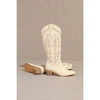 White leather Samantha Knee-High Western Boots with decorative stitching and wooden heel