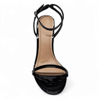 Black patent leather stiletto heel sandal featuring a chic band ankle strap design