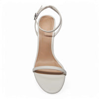 White ankle strap skinny heels from Showy feature a stylish band ankle strap design
