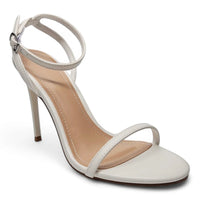 White stiletto heel sandal from Showy, featuring a stylish band ankle strap design
