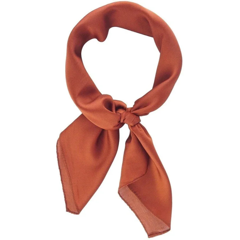 Copper-colored silk satin neckerchief tied in a knot for a stylish indie scarf look