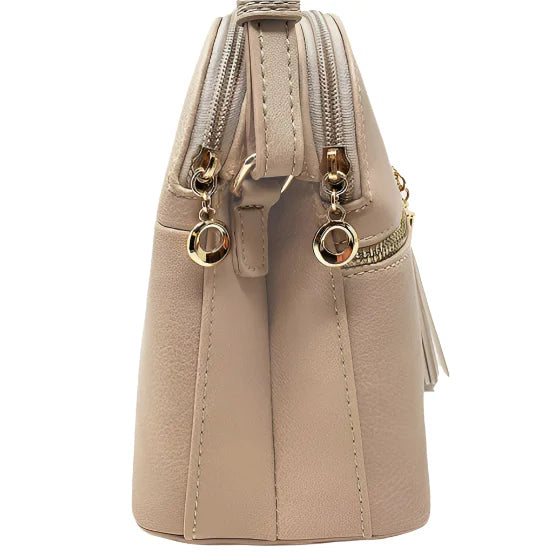 Beige zippered handbag featuring zip tassel multi-compartment design for tassel crossbody style