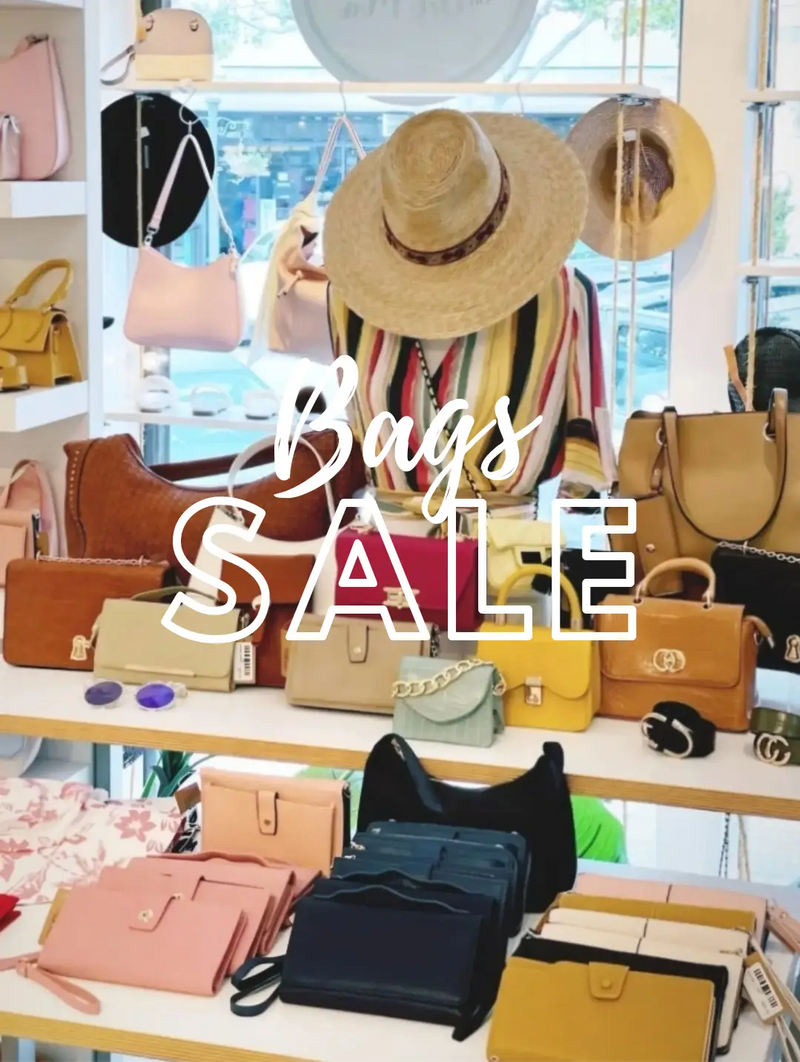 Collection of handbags and hats on display for Del Mar’s women’s sale, enjoy incredible savings.