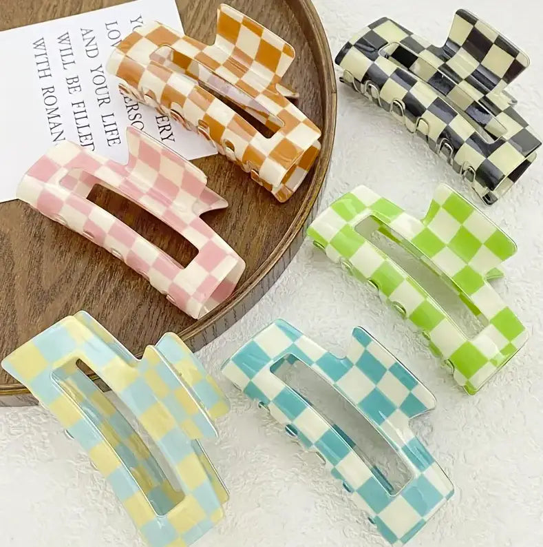 Colorful checkered hair clips in pink, orange, green, and blue for trendy hair accessories