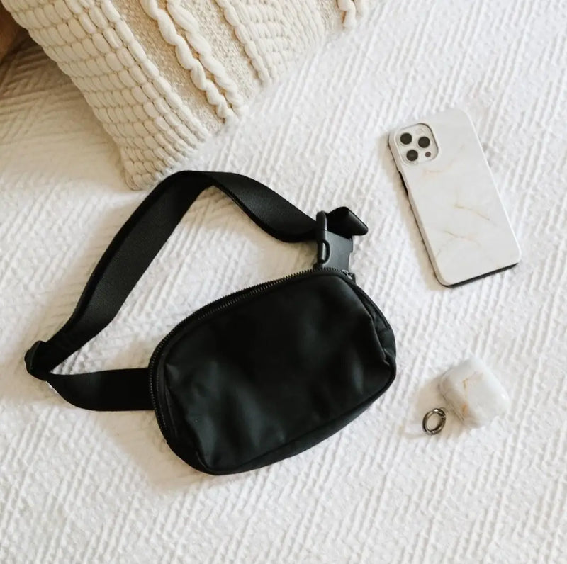 Black fanny pack with adjustable strap from Del Mar’s selection of women’s fanny packs.