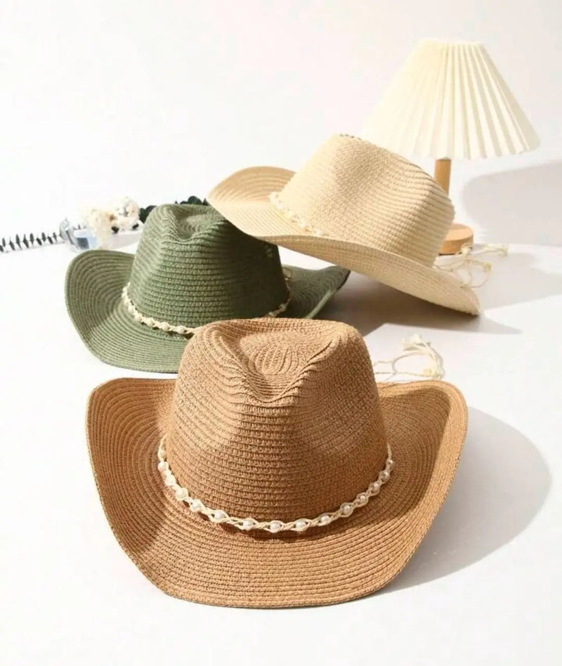 Three stylish women’s straw hats in various colors from Del Mar’s collection.