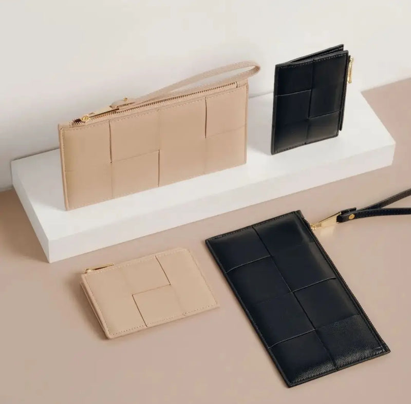 Beige and black leather wallets with geometric patterns from Del Mar’s sophisticated collection.