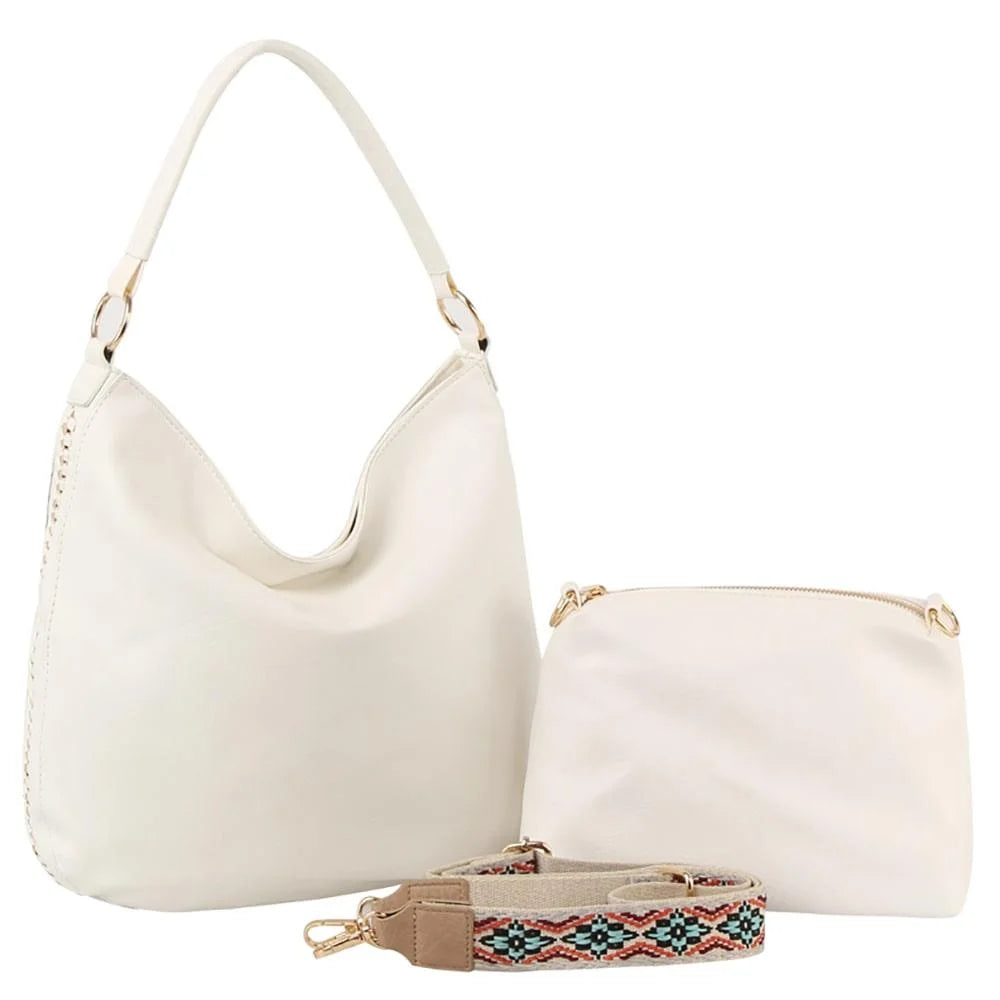 White leather shoulder bag with curved handle and pouch, featuring a guitar strap