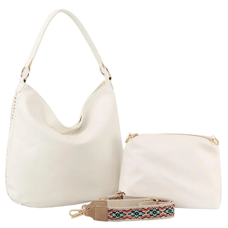 White leather shoulder bag with curved handle and pouch, featuring a guitar strap