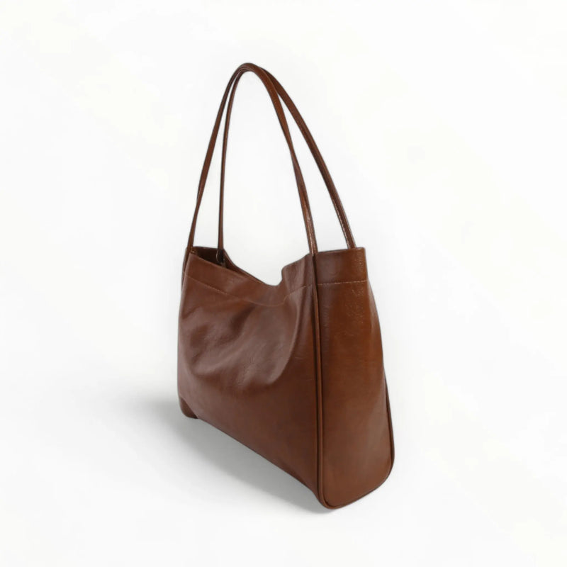 Brown leather shoulder bag with double handles, a stylish faux leather tote bag