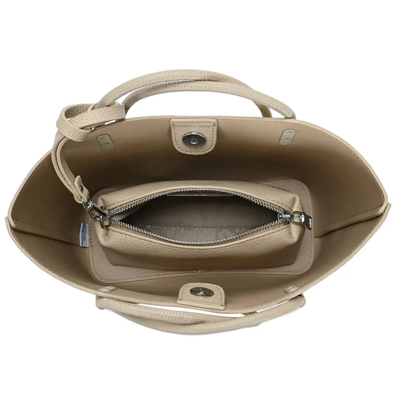 Beige tote bag with smooth textured finish and integrated zipper pouch for versatile use