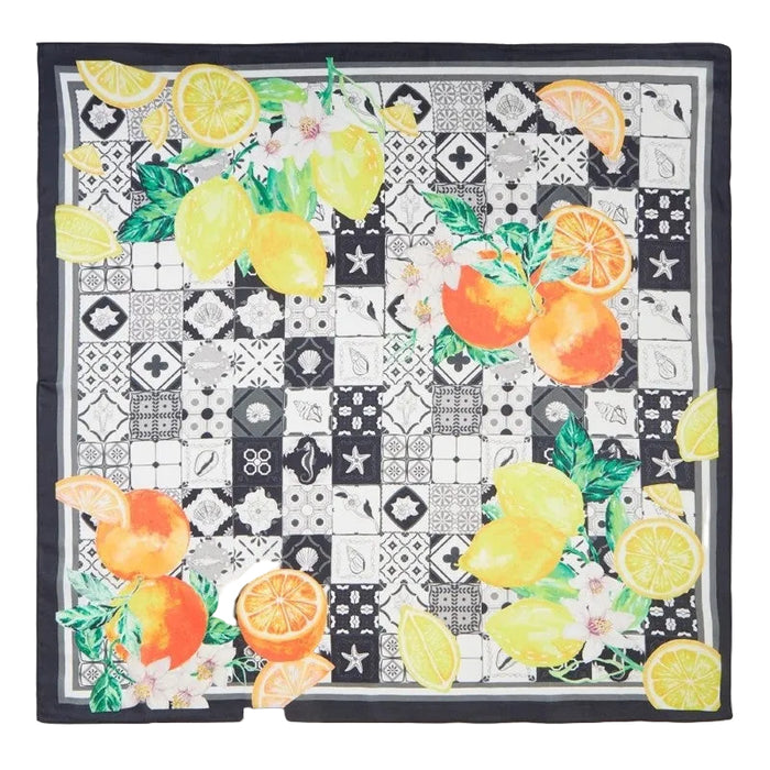 Fruit patterned fabric square with lemons, oranges, and flowers on a black border.
