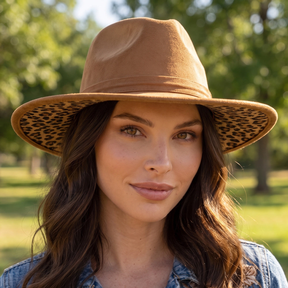 Brown felt fedora with wide brim; leopard-print underbrim peeks out