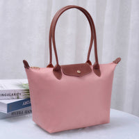 Blush pink luxe tote bag with brown leather trim and front patch pocket