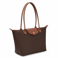 Chocolate brown luxe tote bag with tan leather handles and front patch pocket