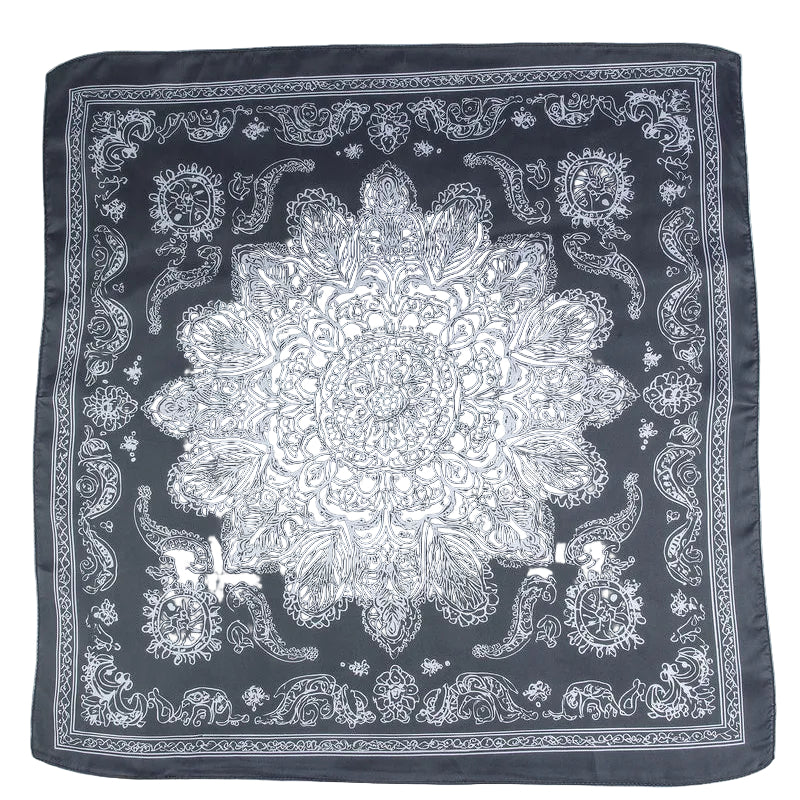 Black bandana with white paisley pattern on a white background