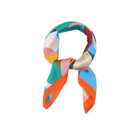 Colorful silk Abstract Flower Print Square Scarf tied in a loop with geometric patterns