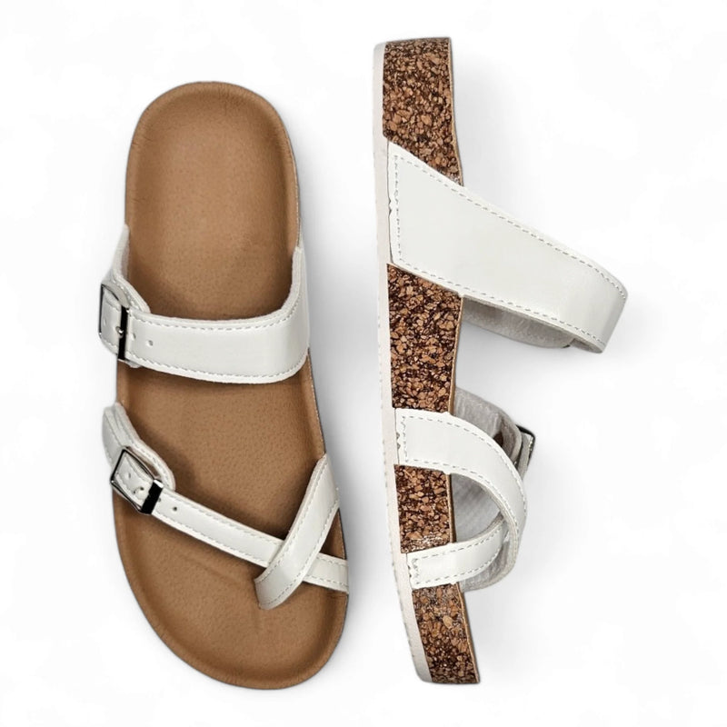 Pair of white strappy Adjustable Birk Sandals with cork-like soles for comfortable style