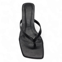 Black leather thong sandal with square toe, ideal for stylish white crinkle kitten heels