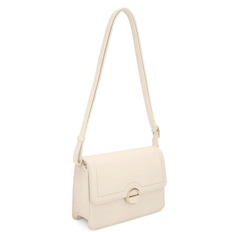 Cream-colored leather Angelica Crossbody Bag with flap closure and metal hardware