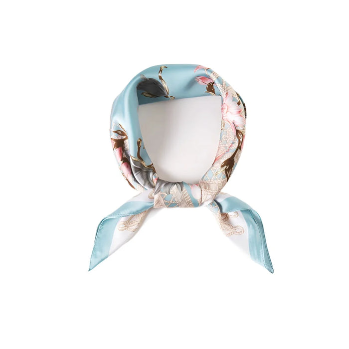 Silk scarf featuring a floral print in light blue and pink tones for stylish accessorizing