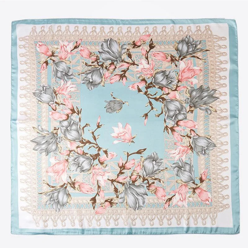 Floral print silk scarf featuring pink and gray flowers on light blue background