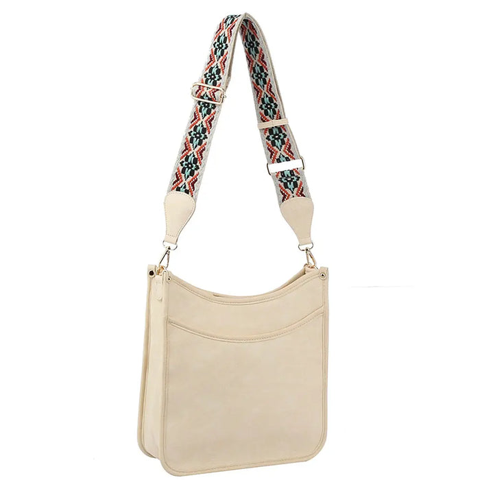 Beige leather handbag with a colorful Aztec tribal printed guitar strap design