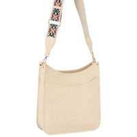 Beige shoulder bag with aztec tribal printed guitar strap for stylish crossbody use