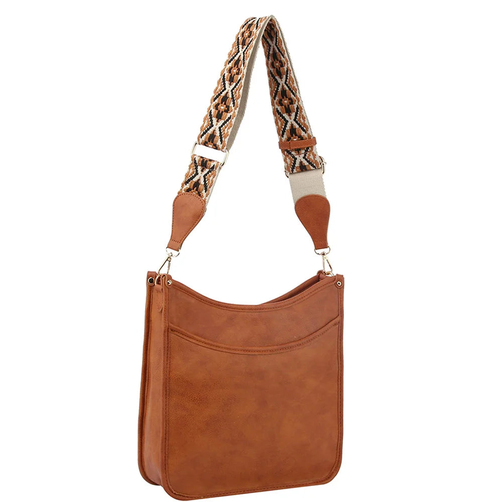 Brown leather shoulder bag with Aztec tribal printed guitar strap for stylish carry