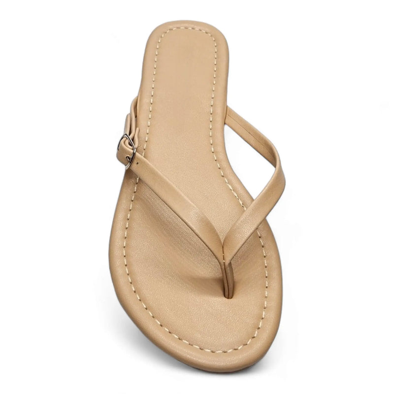 Beige leather flip flops with thin strap and buckle detail for adjustable comfort