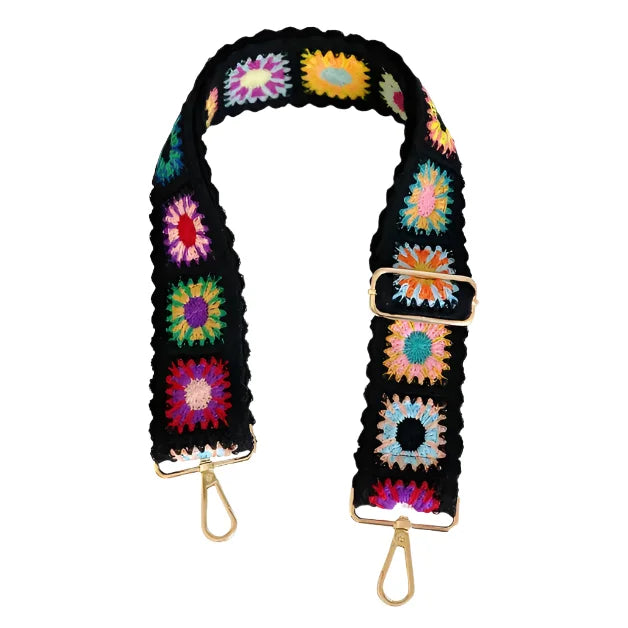 Colorful crocheted bag strap with floral pattern and gold-toned hardware for bohemian bags