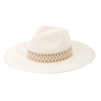 White wide-brimmed Boho Braided Band Fedora Hat with a decorative tan patterned band