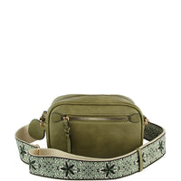 Olive green leather guitar strap crossbody bag with decorative patterned strap