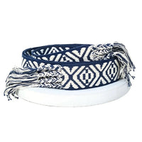 Woven boho stripe pattern braided belt with blue and white geometric design and fringed ends