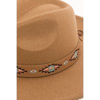 Tan felt cowboy hat with boho tribal pattern strap and Southwestern-style hatband