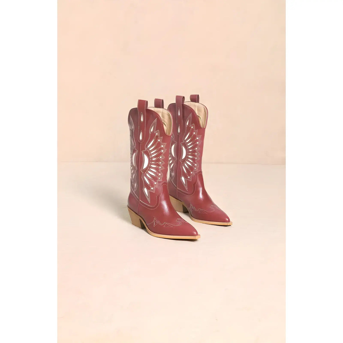 Red leather Britney Cut Out Western boots with decorative white stitching and pointed toes