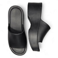 Black Brooklyn Platform Slides featuring open toes and a stylish slide-on design