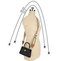 Beige dress form mannequin showcasing a brown guitar bag strap with a black handbag