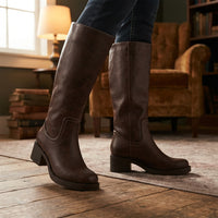 Dark brown tall boots with square toe and block heel worn with jeans